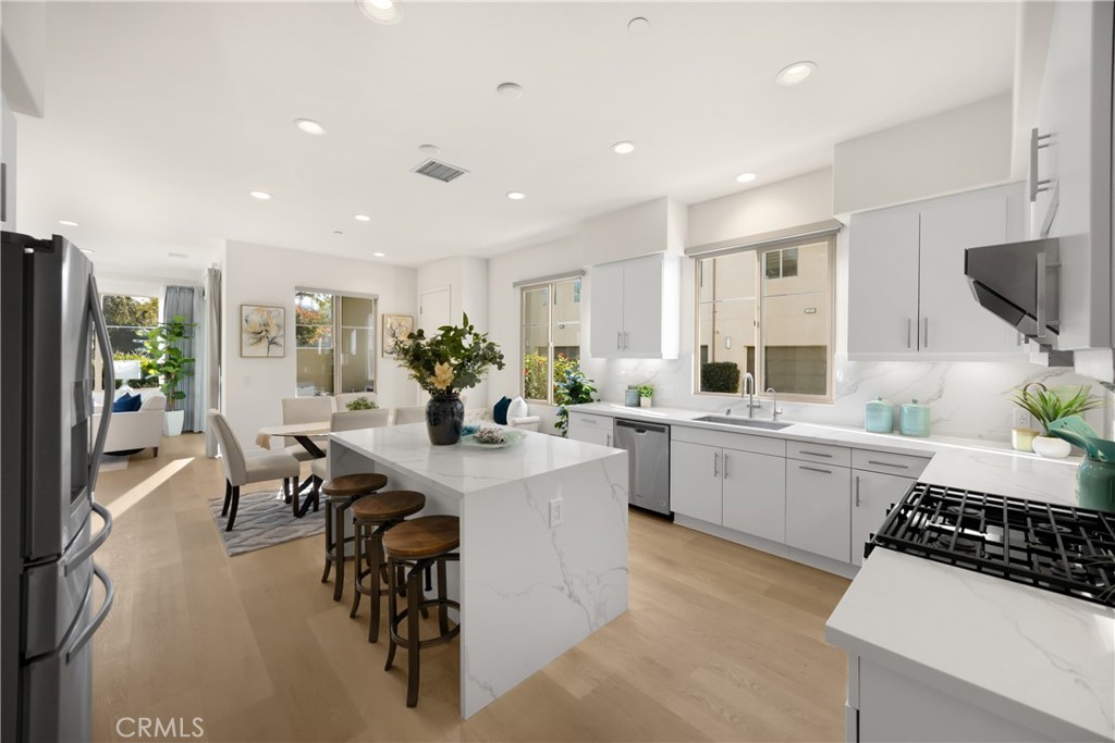269 Magnet Irvine, CA 92618 - Photo 8 of 61 a kitchen with sink cabinets and dining table chair