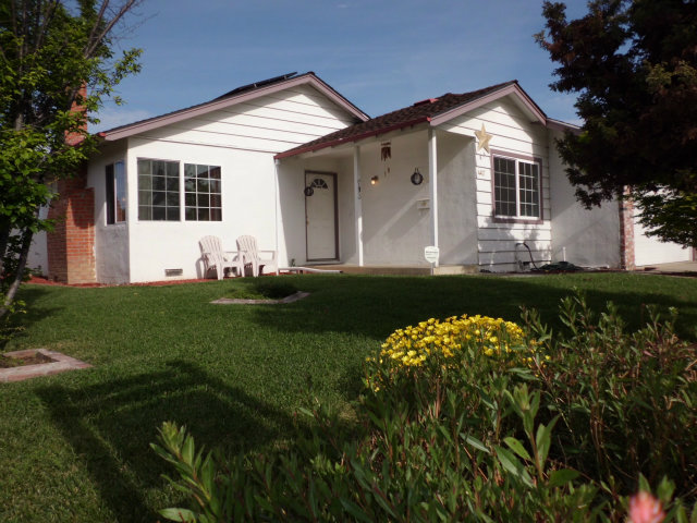 4417 Williams Road San Jose, CA 95129 - Photo 1 of 10 a front view of a house with a garden