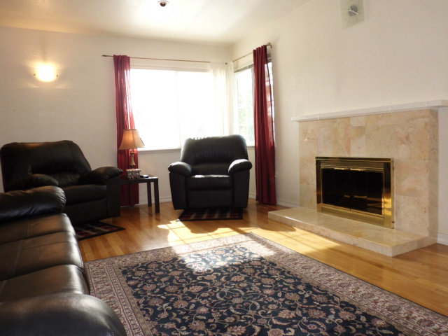 4417 Williams Road San Jose, CA 95129 - Photo 3 of 10 a living room with furniture window and a fireplace