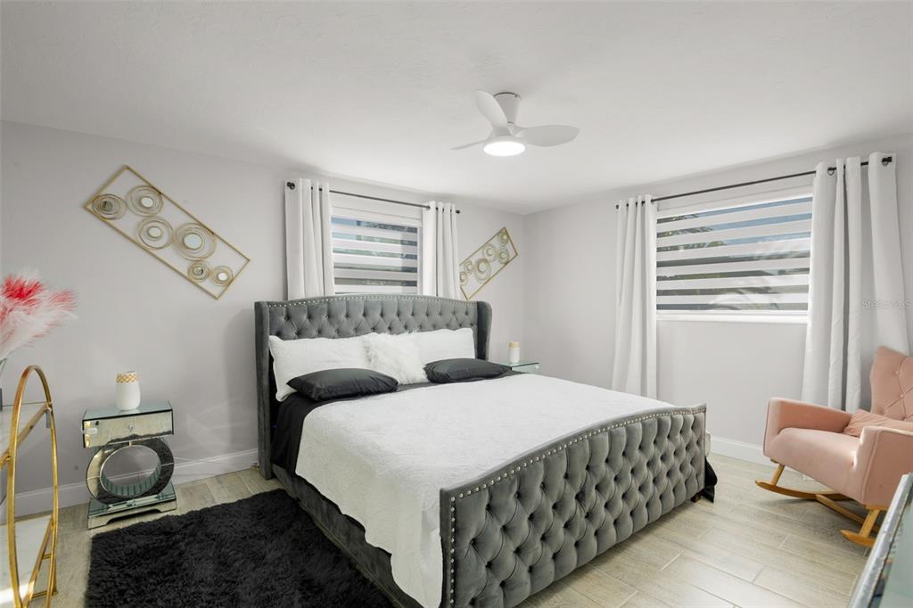 4149 Darlington Road Holiday, FL 34691 - Photo 12 of 34 a bedroom with a bed and wooden floor