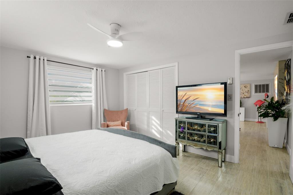 4149 Darlington Road Holiday, FL 34691 - Photo 14 of 34 a bedroom with a bed and a flat screen tv