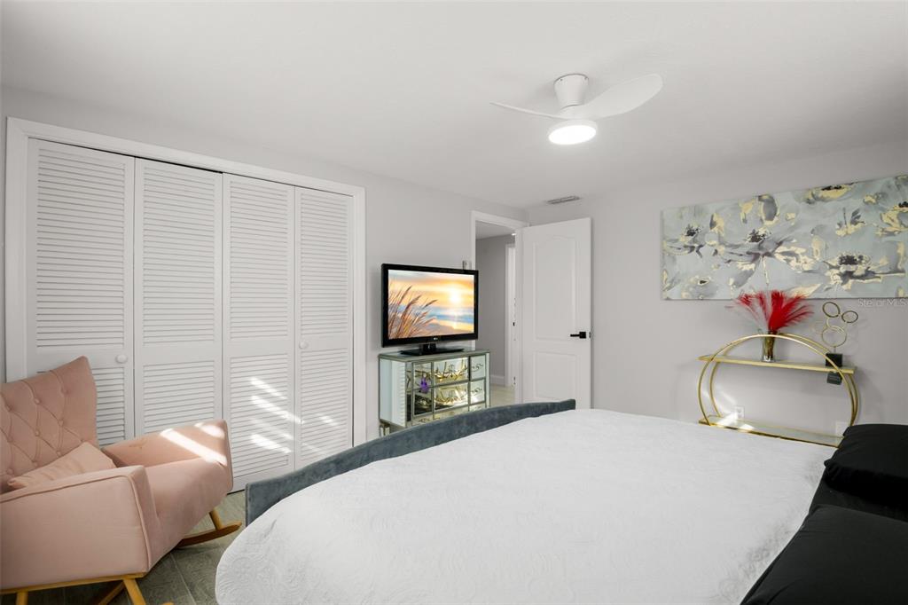 4149 Darlington Road Holiday, FL 34691 - Photo 16 of 34 a bedroom with a bed and a flat screen tv