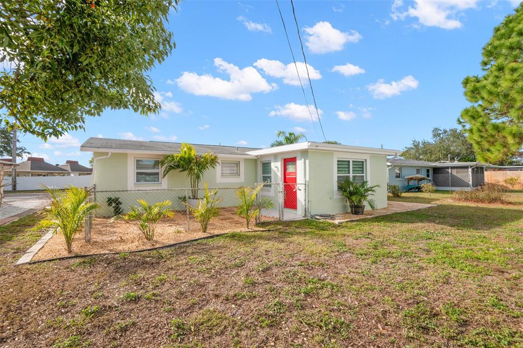 4149 Darlington Road Holiday, FL 34691 - Photo 17 of 34 a front view of house with patio and garden