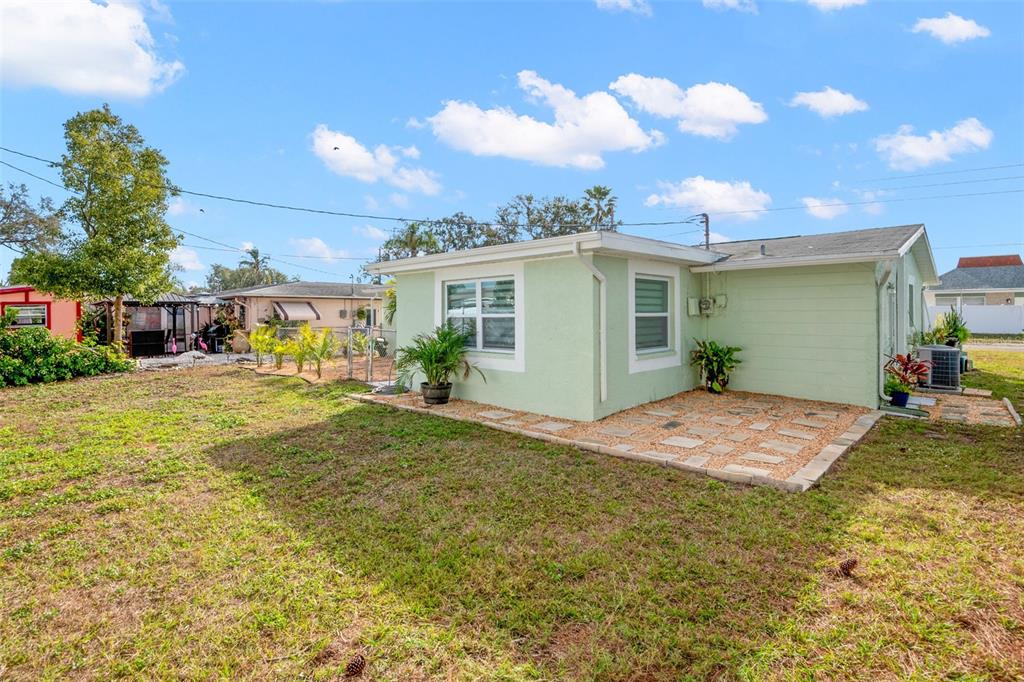 4149 Darlington Road Holiday, FL 34691 - Photo 18 of 34 a view of a house with backyard and sitting area