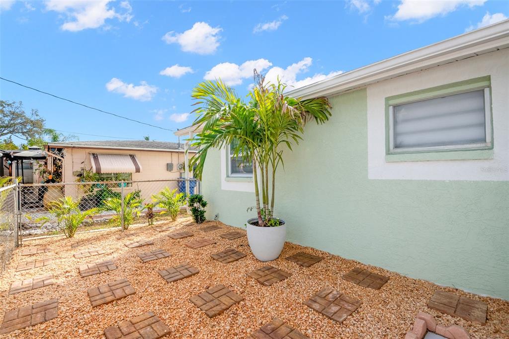 4149 Darlington Road Holiday, FL 34691 - Photo 19 of 34 a view of a porch with a table and chairs