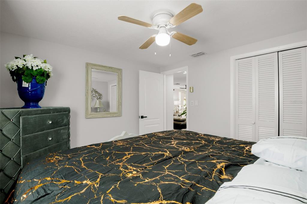 4149 Darlington Road Holiday, FL 34691 - Photo 22 of 34 a bedroom with a bed and a potted plant