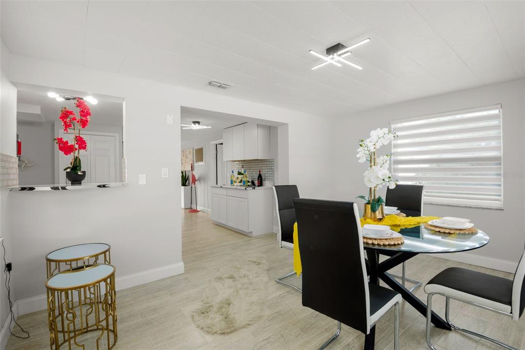 4149 Darlington Road Holiday, FL 34691 - Photo 27 of 34 a living room with furniture and kitchen view