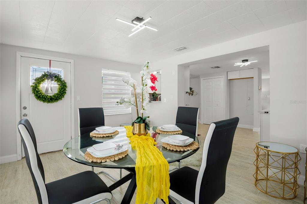 4149 Darlington Road Holiday, FL 34691 - Photo 28 of 34 a view of a dining room with furniture and chandelier