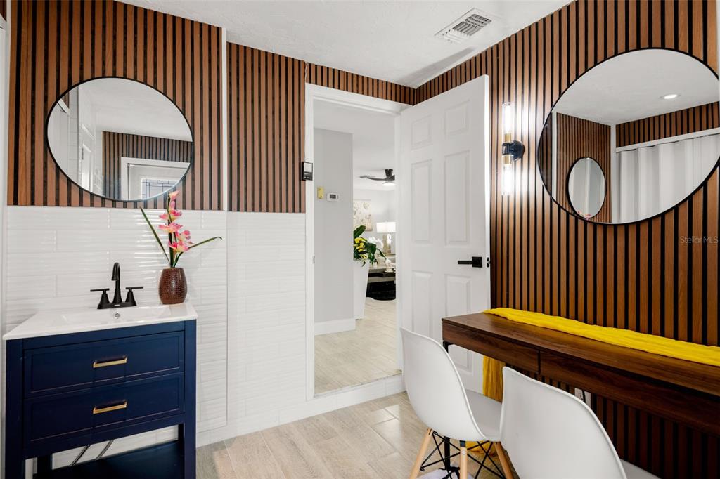 4149 Darlington Road Holiday, FL 34691 - Photo 30 of 34 a view of a hallway with couches a mirror and a potted plant