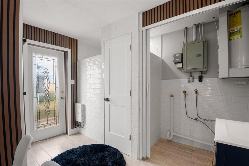 4149 Darlington Road Holiday, FL 34691 - Photo 32 of 34 a spacious bathroom with a glass shower door and a sink