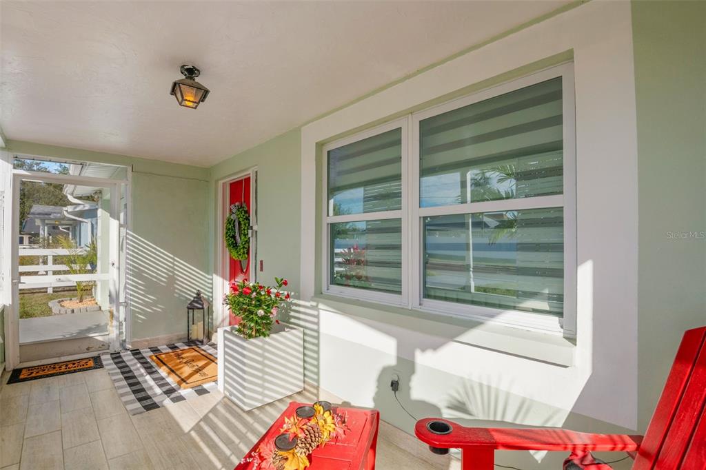 4149 Darlington Road Holiday, FL 34691 - Photo 5 of 34 a living room filled with furniture and a potted plant