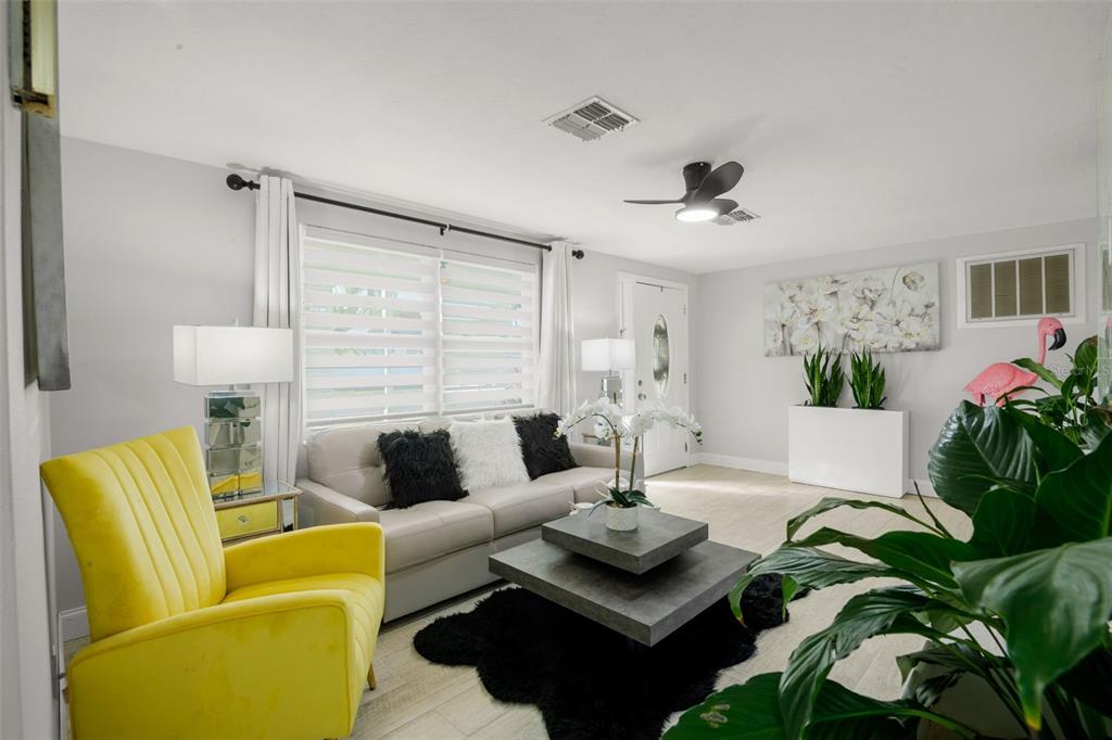4149 Darlington Road Holiday, FL 34691 - Photo 8 of 34 a living room with furniture potted plant and a window