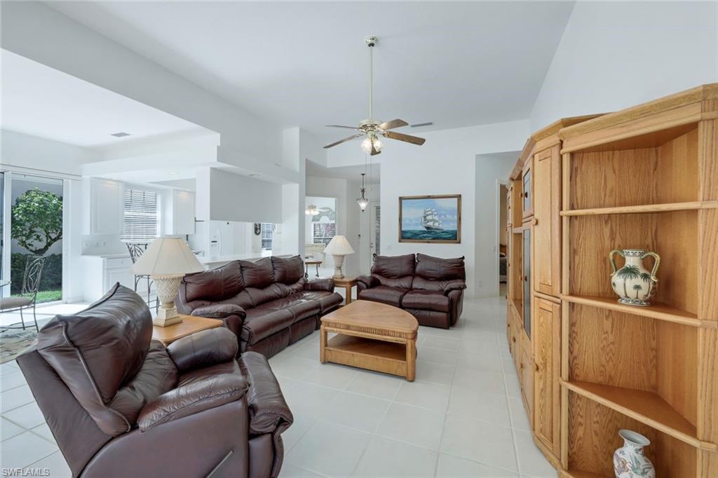 3059 Ellice Way Naples, FL 34119 - Photo 23 of 50 a living room with furniture and a window