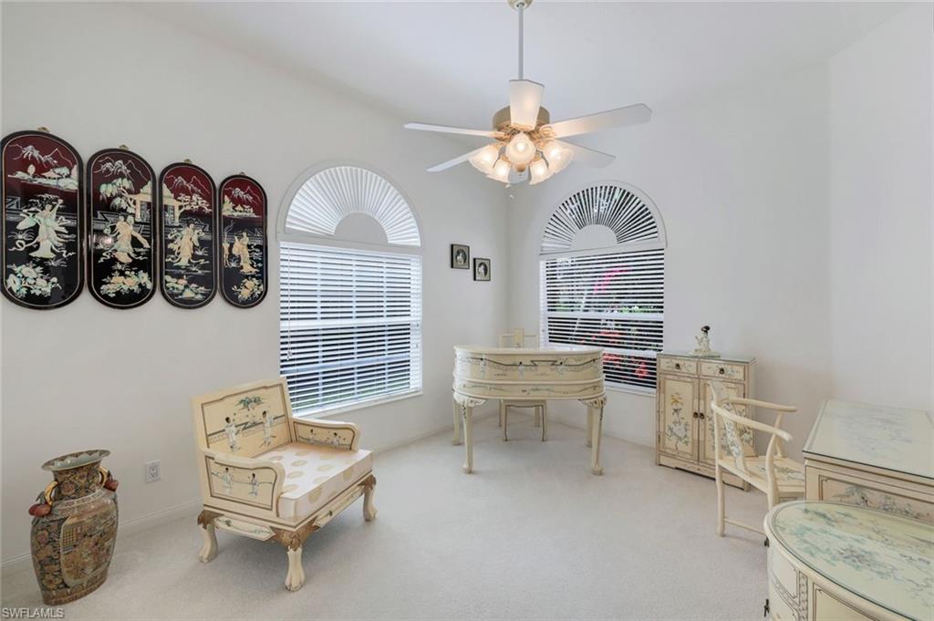 3059 Ellice Way Naples, FL 34119 - Photo 25 of 50 a view of a livingroom with furniture and a window