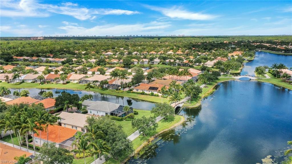 3059 Ellice Way Naples, FL 34119 - Photo 26 of 50 an aerial view of residential houses with outdoor space and ocean view