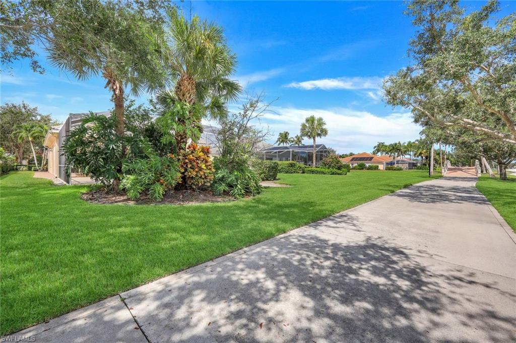 3059 Ellice Way Naples, FL 34119 - Photo 29 of 50 a view of a park with a tree in the background