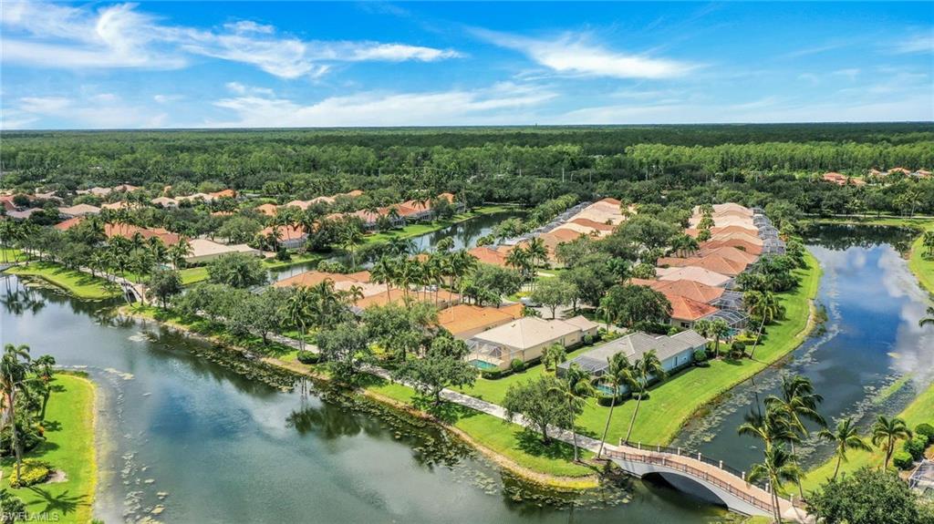 3059 Ellice Way Naples, FL 34119 - Photo 30 of 50 an aerial view of residential houses with outdoor space and lake view