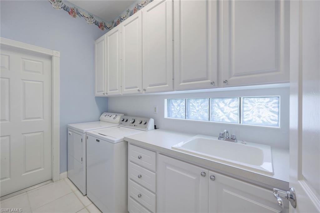 3059 Ellice Way Naples, FL 34119 - Photo 34 of 50 a utility room with a sink washer and dryer