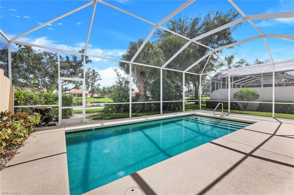 3059 Ellice Way Naples, FL 34119 - Photo 5 of 50 a view of a backyard with swimming pool