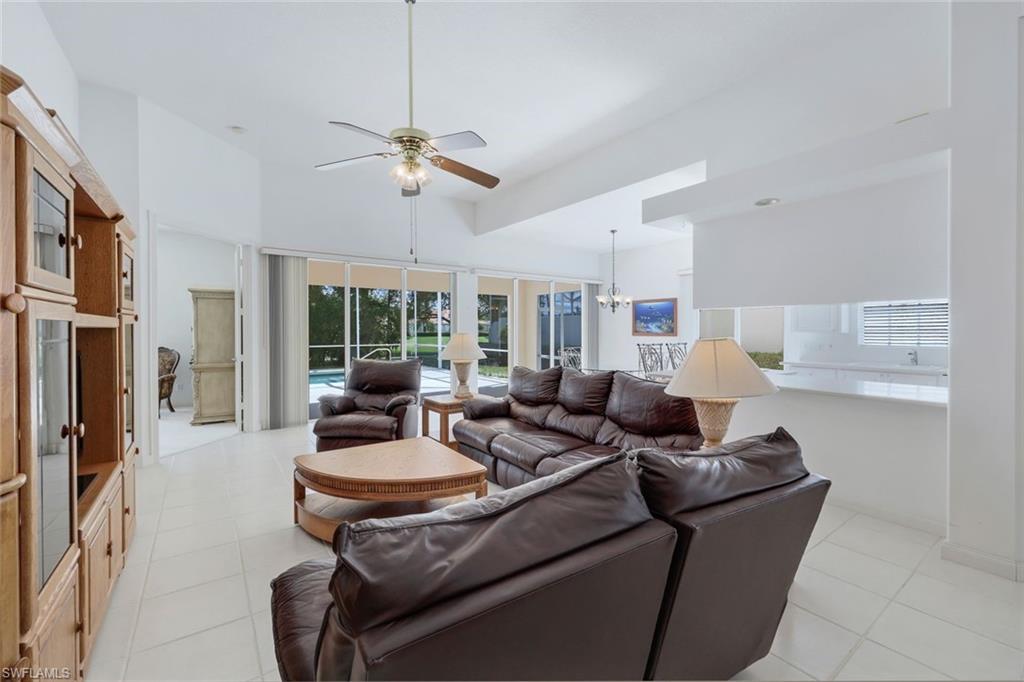 3059 Ellice Way Naples, FL 34119 - Photo 8 of 50 a living room with furniture and a large window