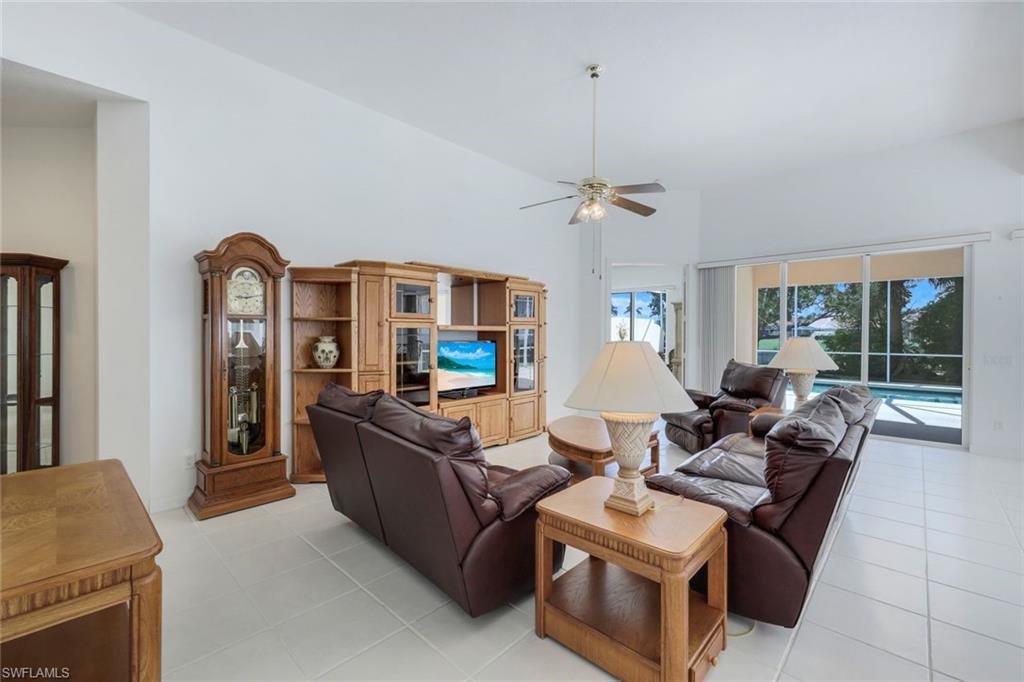 3059 Ellice Way Naples, FL 34119 - Photo 10 of 50 a living room with furniture and a flat screen tv