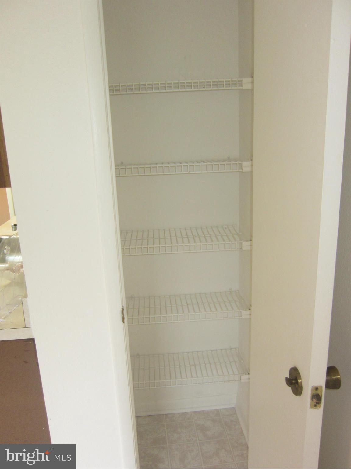 15310 Beaverbrook Court, Unit 891B Silver Spring, MD 20906 - Photo 11 of 26 Kitchen has large pantry