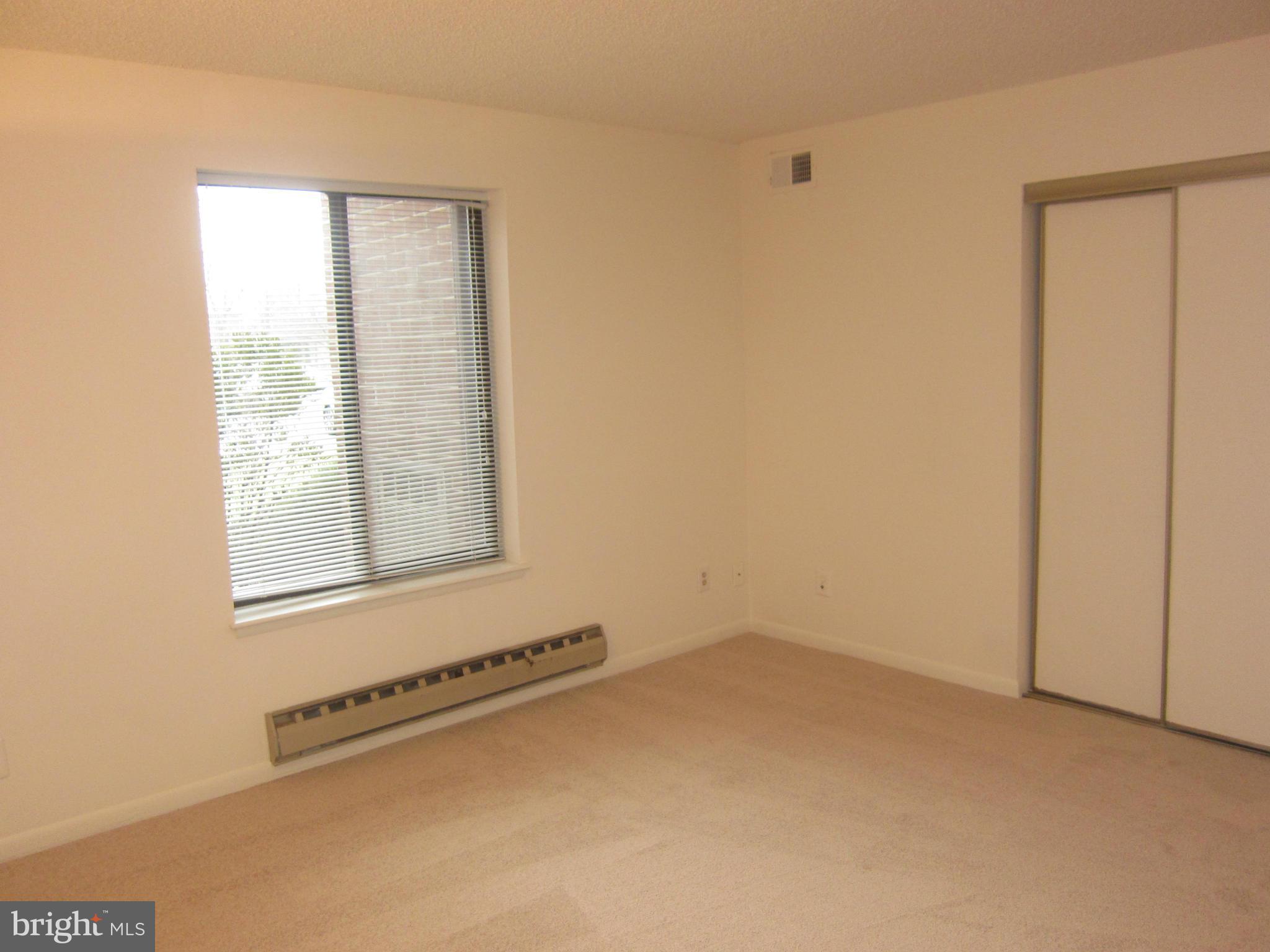 15310 Beaverbrook Court, Unit 891B Silver Spring, MD 20906 - Photo 16 of 26 Bedroom offers two closets