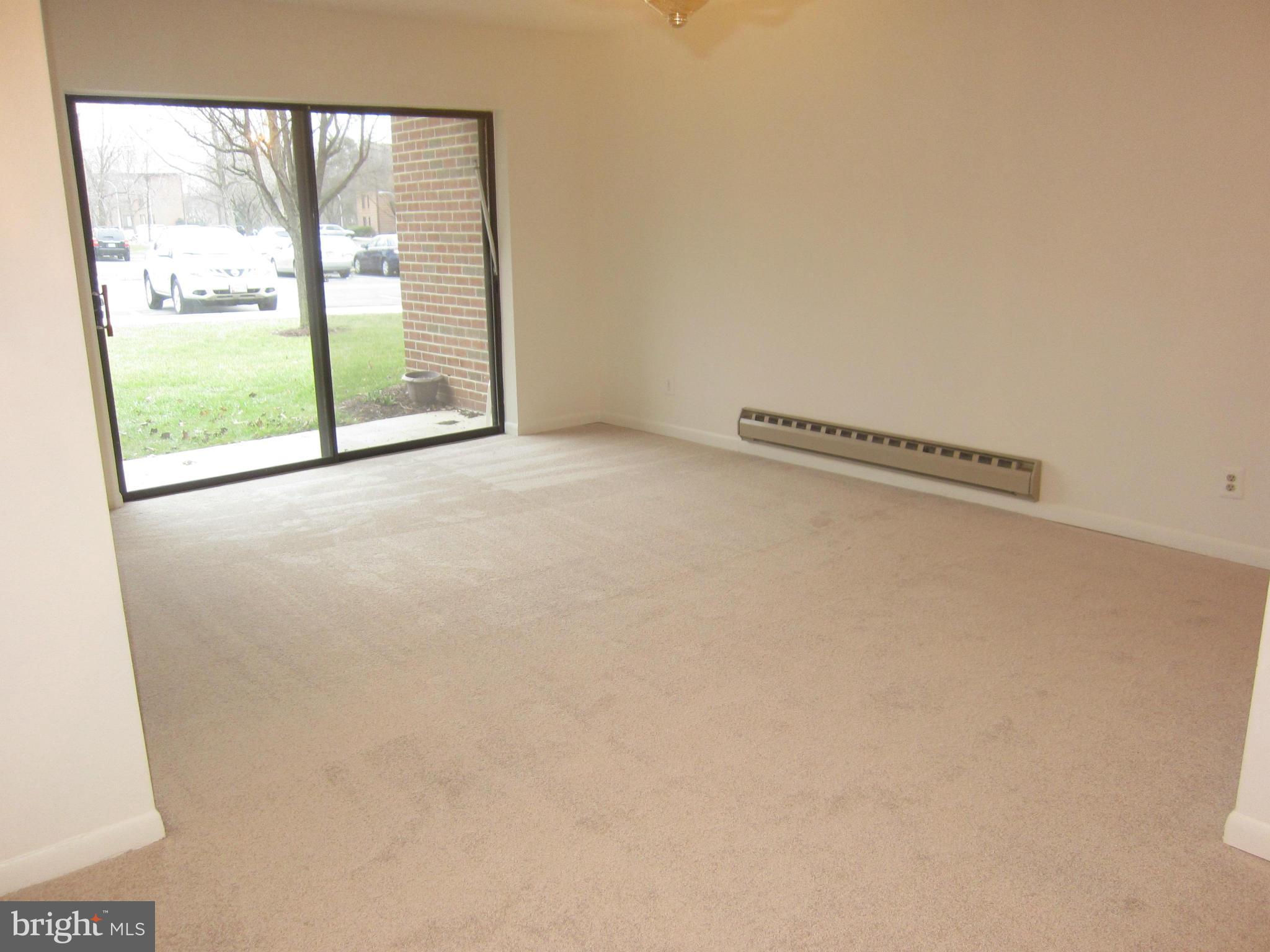 15310 Beaverbrook Court, Unit 891B Silver Spring, MD 20906 - Photo 4 of 26 Large living room faces front