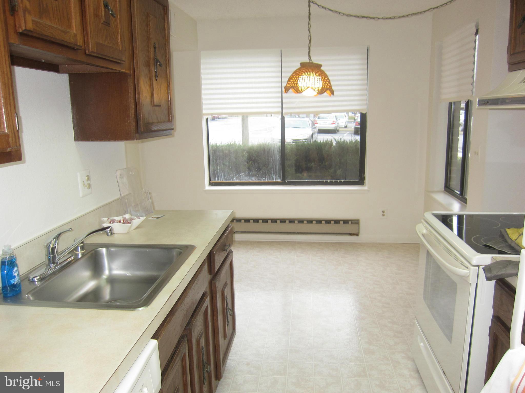 15310 Beaverbrook Court, Unit 891B Silver Spring, MD 20906 - Photo 6 of 26 Bright kitchen with large windows facing front