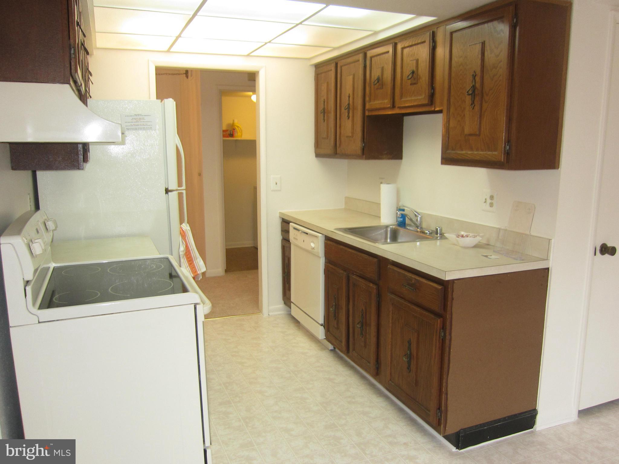 15310 Beaverbrook Court, Unit 891B Silver Spring, MD 20906 - Photo 7 of 26 Kitchen offers many cabinets
