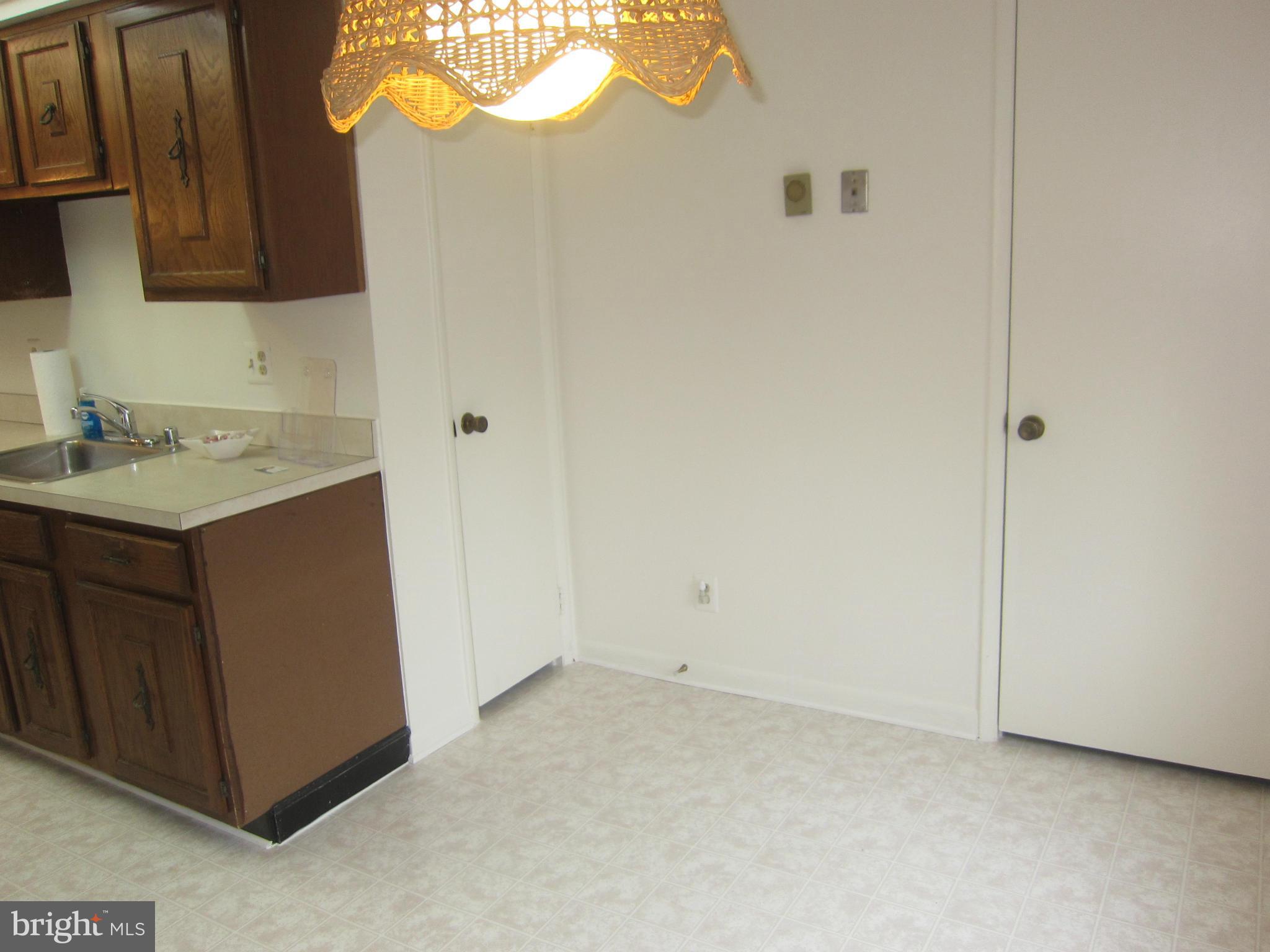 15310 Beaverbrook Court, Unit 891B Silver Spring, MD 20906 - Photo 9 of 26 Kitchen with new vinyl flooring