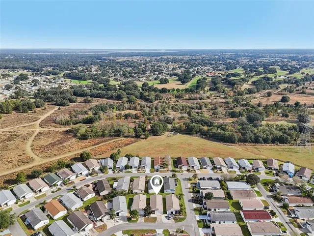 an aerial view of a house with a garden