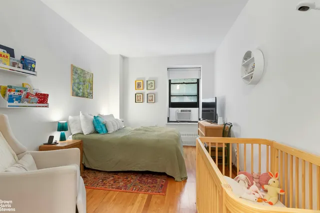 a kitchen with granite countertop a dining table chairs and wooden floor