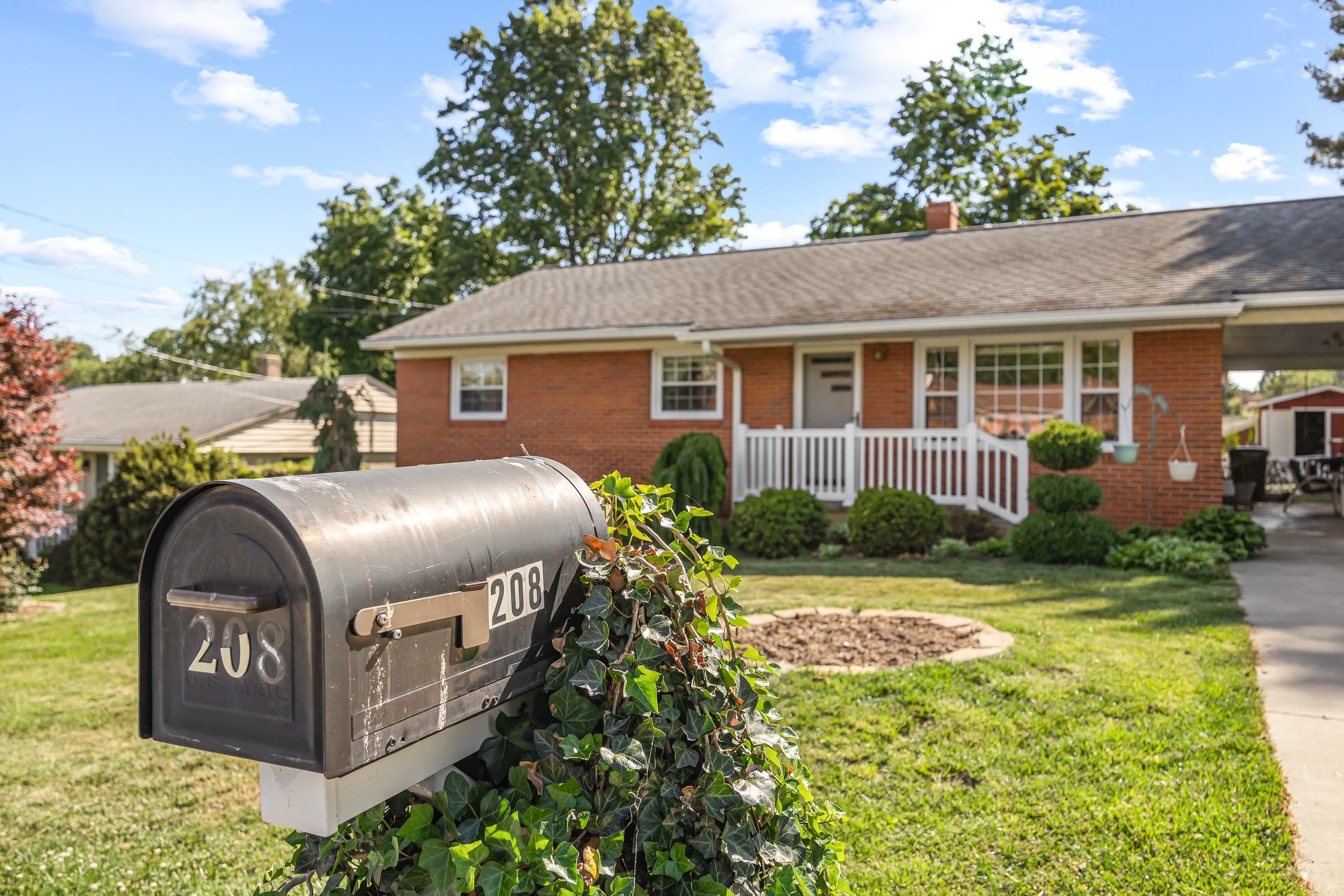 208 Tuxedo Road Staunton, VA 24401 - Photo 2 of 46 a front view of a house with garden