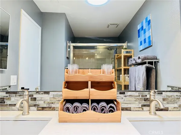 a view of a kitchen with a sink and living room