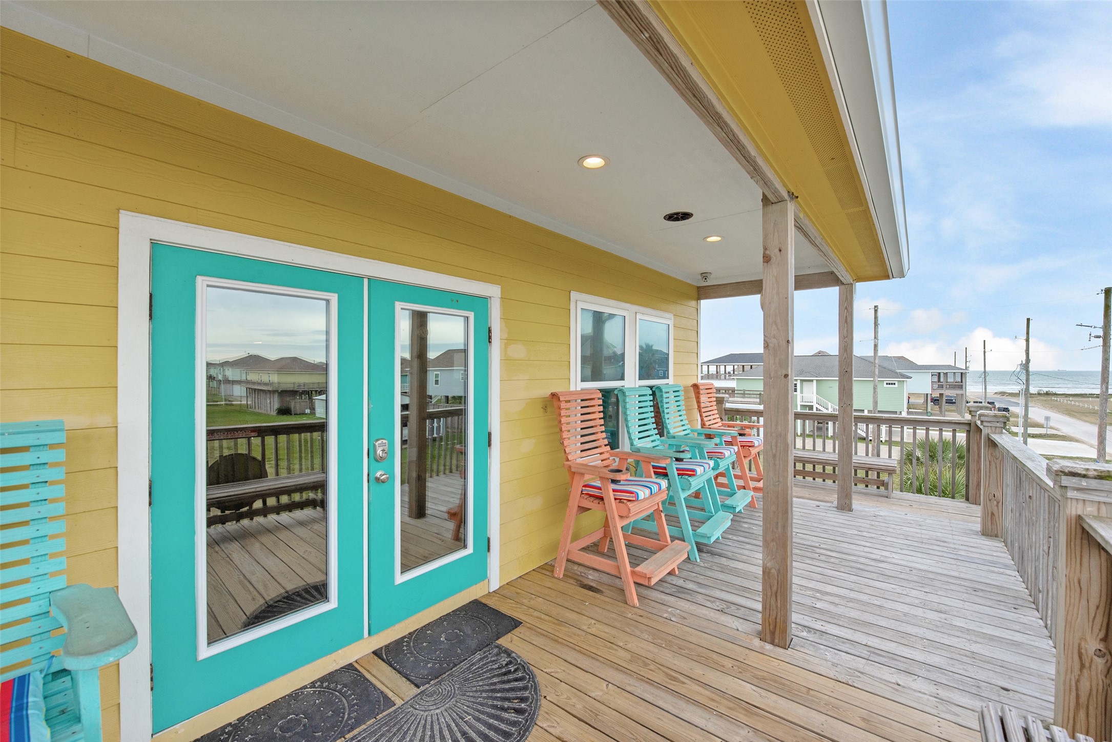 858 South East Road Crystal Beach, TX 77650 - Photo 20 of 44 a living room with furniture and a floor to ceiling window