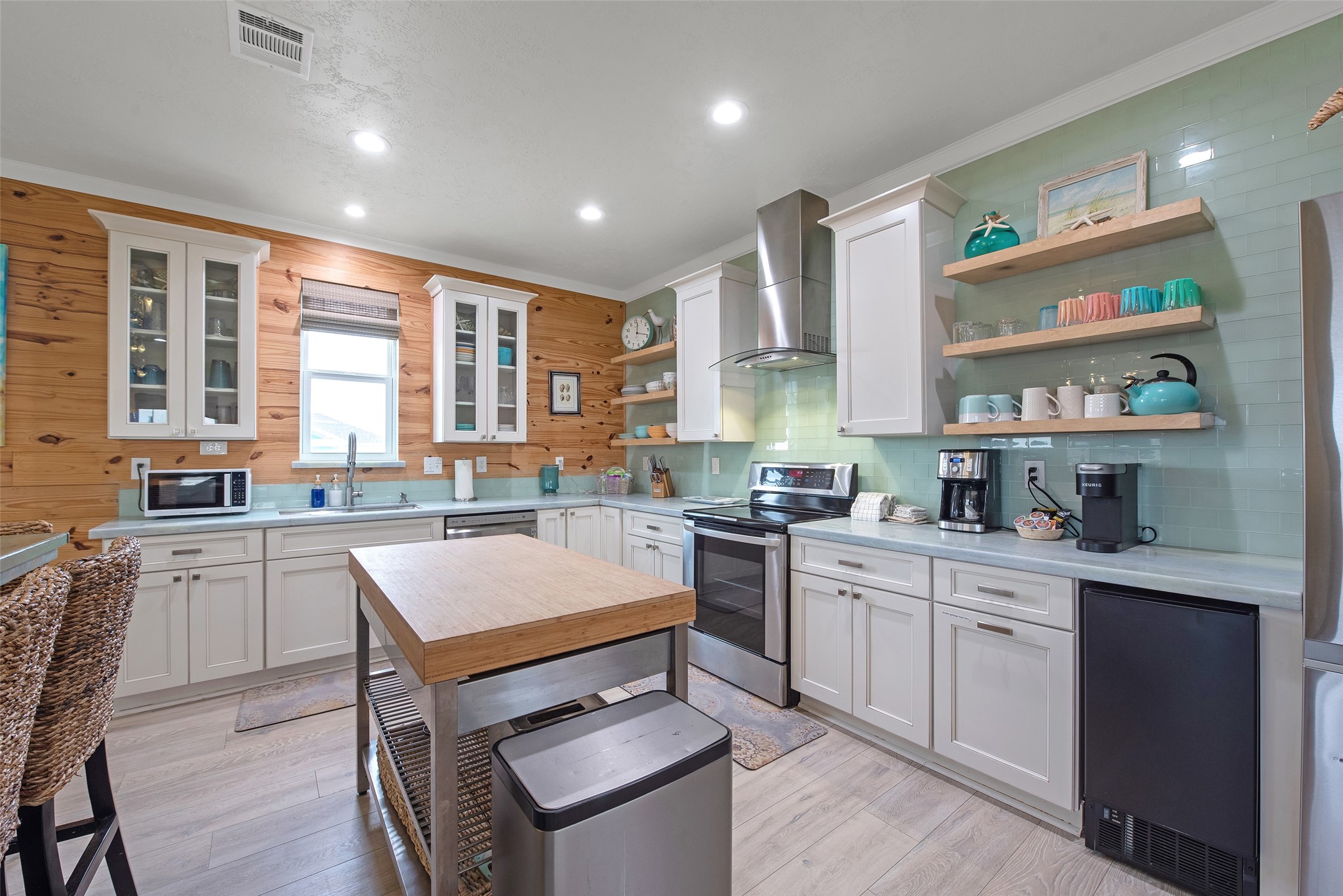 858 South East Road Crystal Beach, TX 77650 - Photo 32 of 44 a kitchen with a sink stove and cabinets