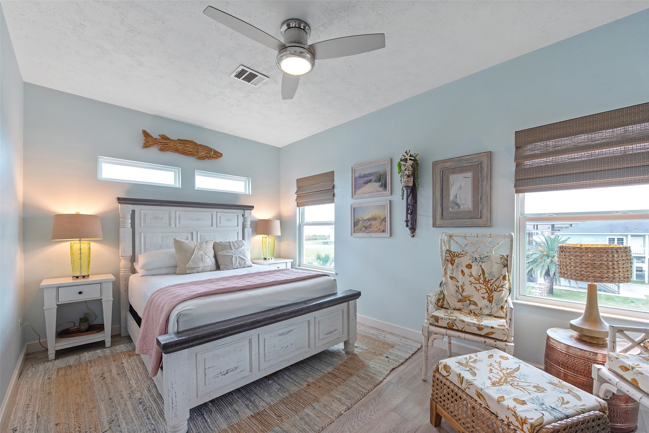 858 South East Road Crystal Beach, TX 77650 - Photo 39 of 44 a bedroom with a bed and wooden floor