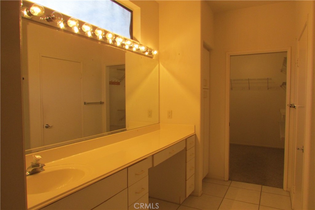 78281 Bovee Circle Palm Desert, CA 92211 - Photo 18 of 38 a bathroom with a sink and a mirror