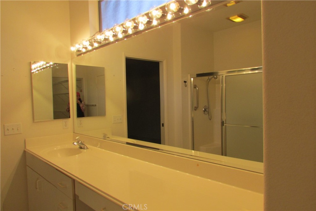 78281 Bovee Circle Palm Desert, CA 92211 - Photo 19 of 38 a bathroom with a sink and a mirror