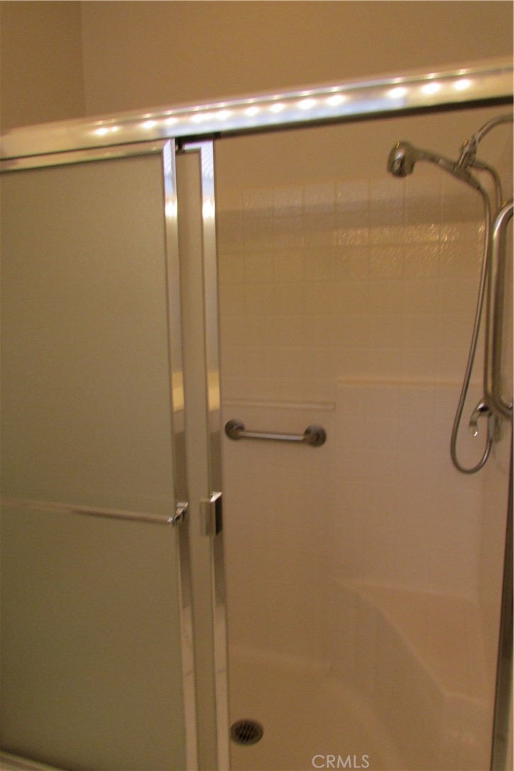 78281 Bovee Circle Palm Desert, CA 92211 - Photo 21 of 38 a bathroom with a glass shower door