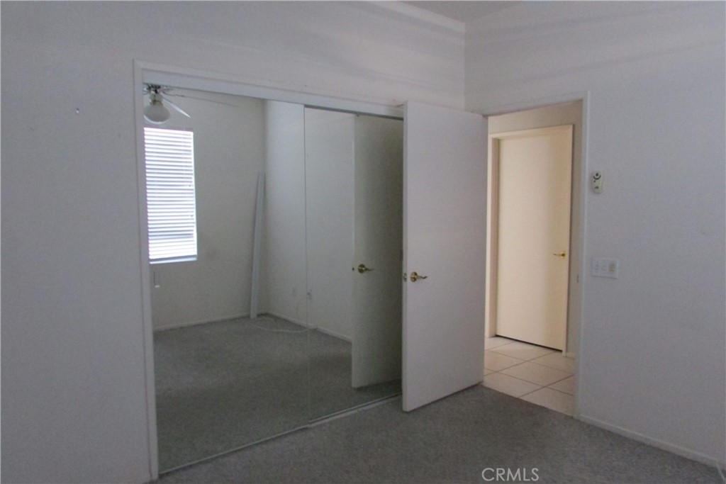 78281 Bovee Circle Palm Desert, CA 92211 - Photo 23 of 38 a view of an empty room with closet and a window
