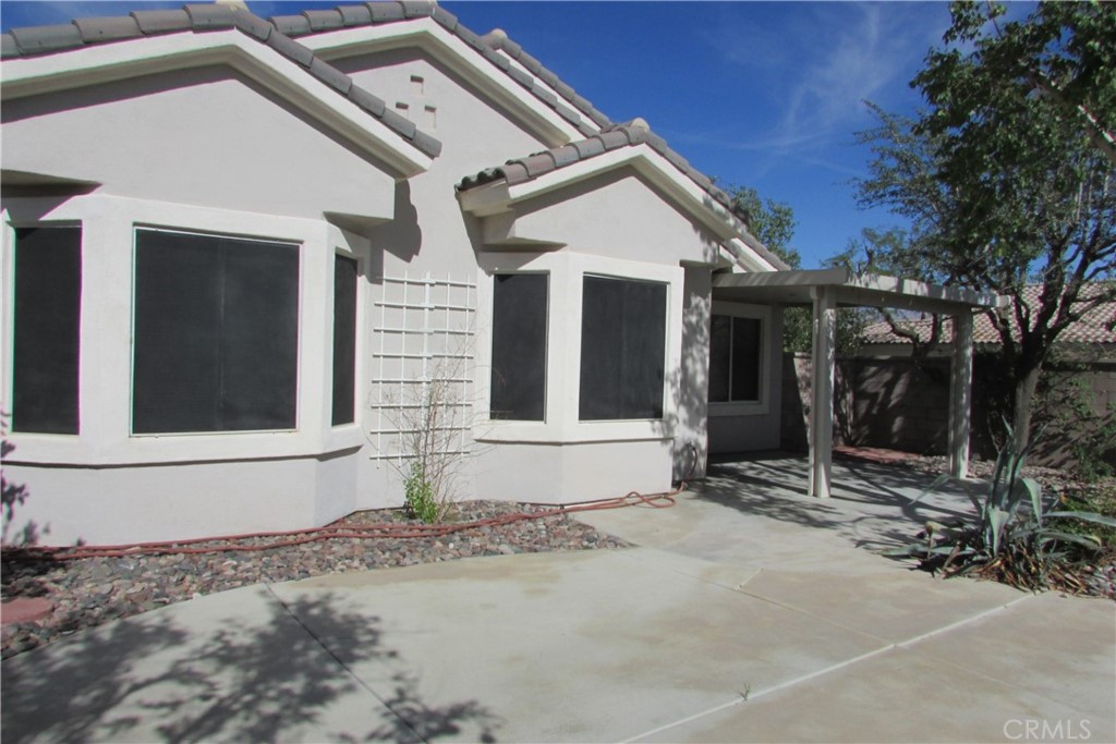 78281 Bovee Circle Palm Desert, CA 92211 - Photo 31 of 38 a front view of a house with garden