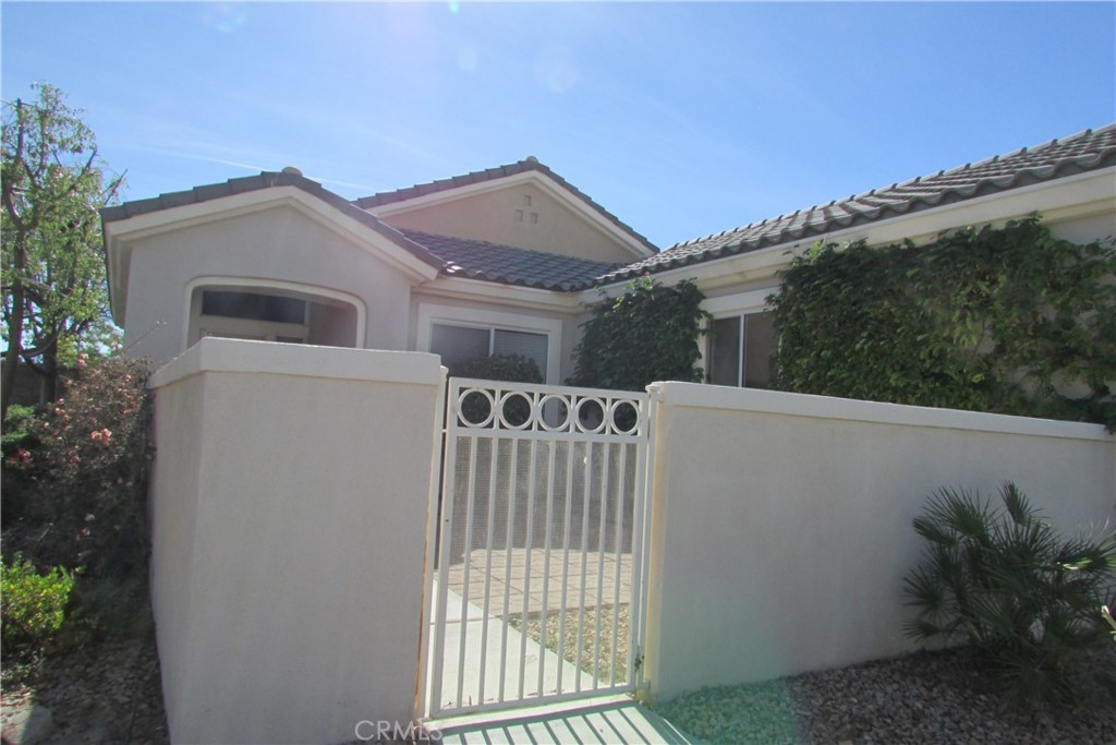 78281 Bovee Circle Palm Desert, CA 92211 - Photo 4 of 38 a view of a house with a yard