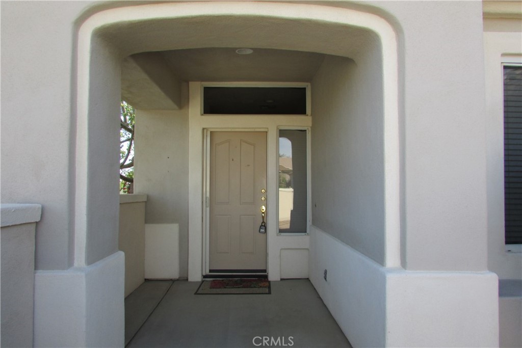 78281 Bovee Circle Palm Desert, CA 92211 - Photo 8 of 38 a view of a hallway with wooden floor and entryway
