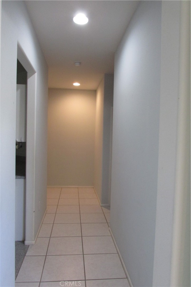 78281 Bovee Circle Palm Desert, CA 92211 - Photo 10 of 38 a view of hallway with a window and a bathroom