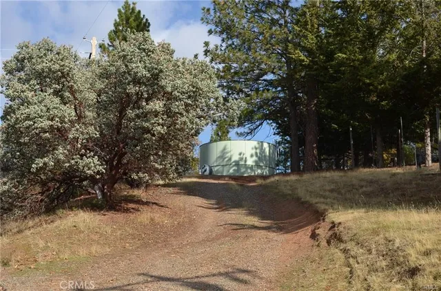 a view of a mountain range in a cloudy sky