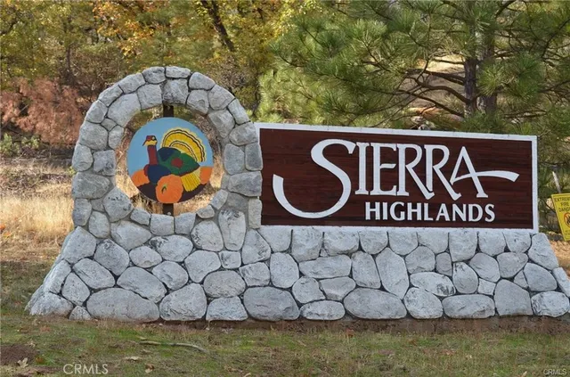a view of a mountain range in a cloudy sky