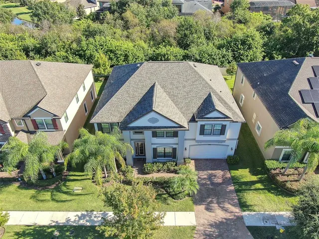 a aerial view of a house with a yard