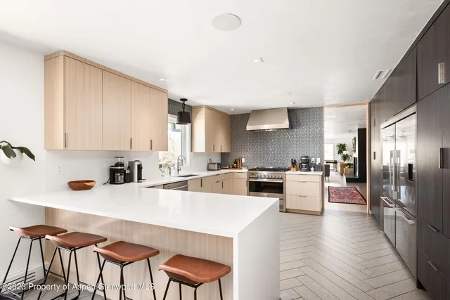 a view of a room with balcony and wooden floor
